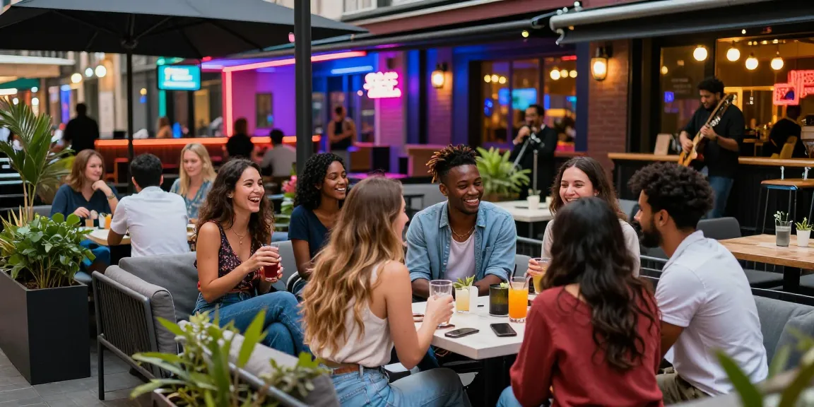 Vibrant urban nightlife scene showcasing socializing at 유흥사이트 with friends enjoying drinks and entertainment in a colorful outdoor setting.